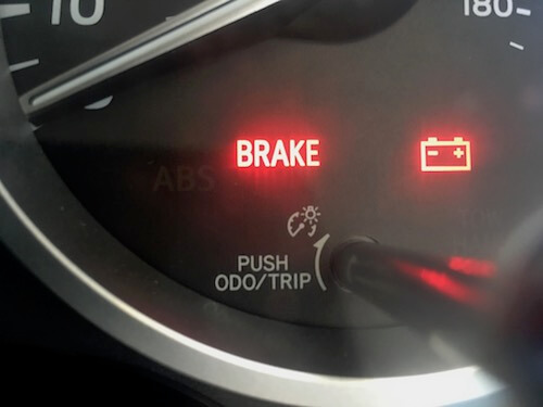 Dashboard warning lights including brake wear indicator